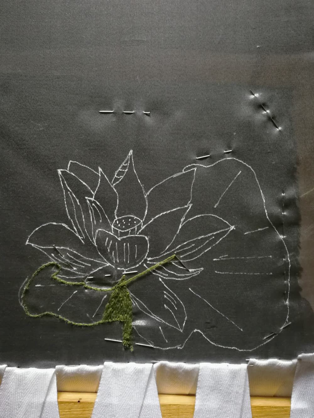 Back side of the embroidery with the white marker lines