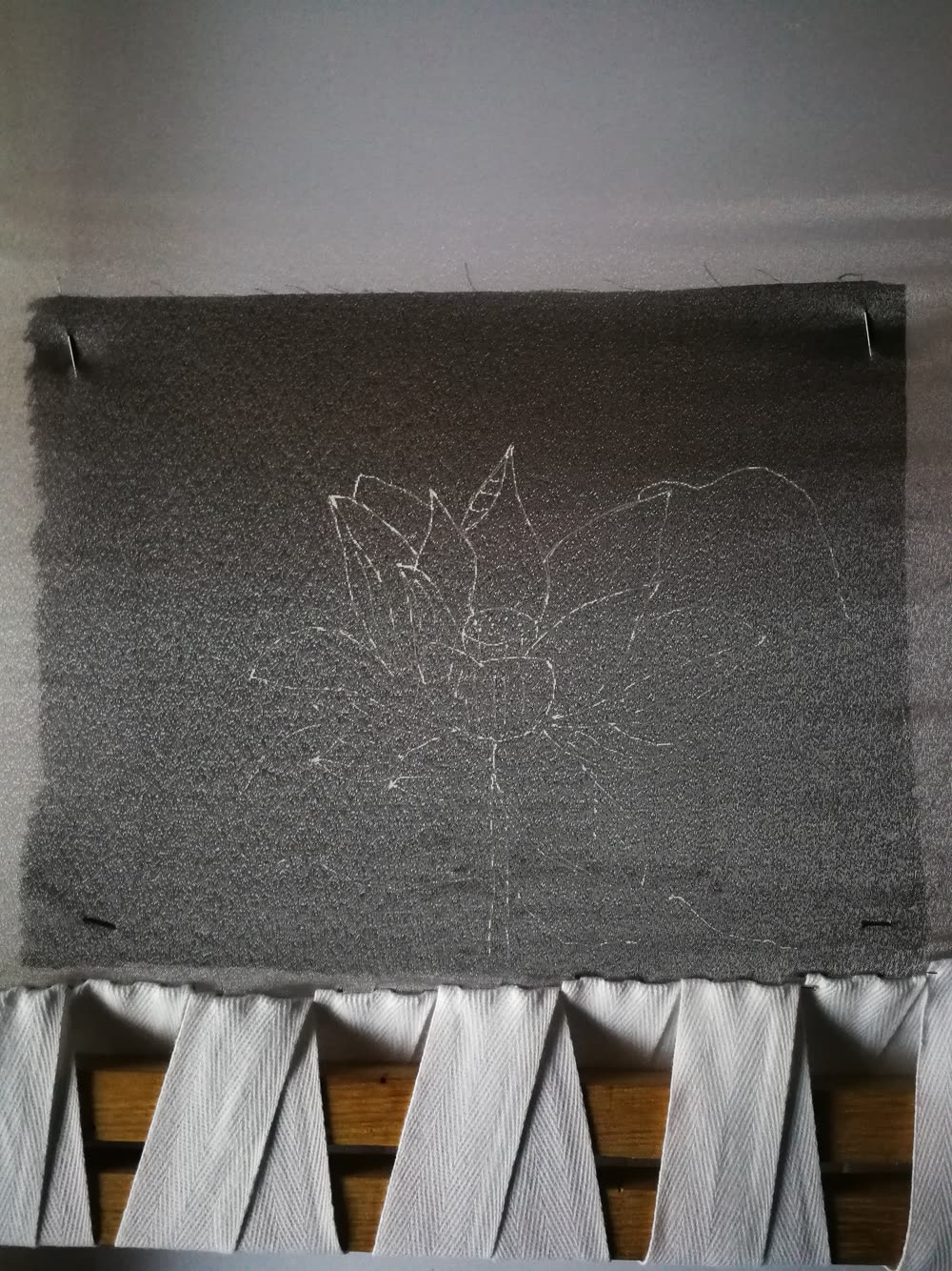 Lotus pattern transferred onto organza on a frame